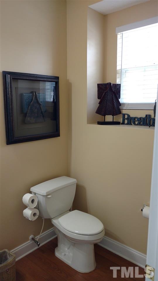 3812 Tryon Ridge Drive Raleigh, NC 27610 - Photo 6 of 23 a bathroom with a toilet and a vanity