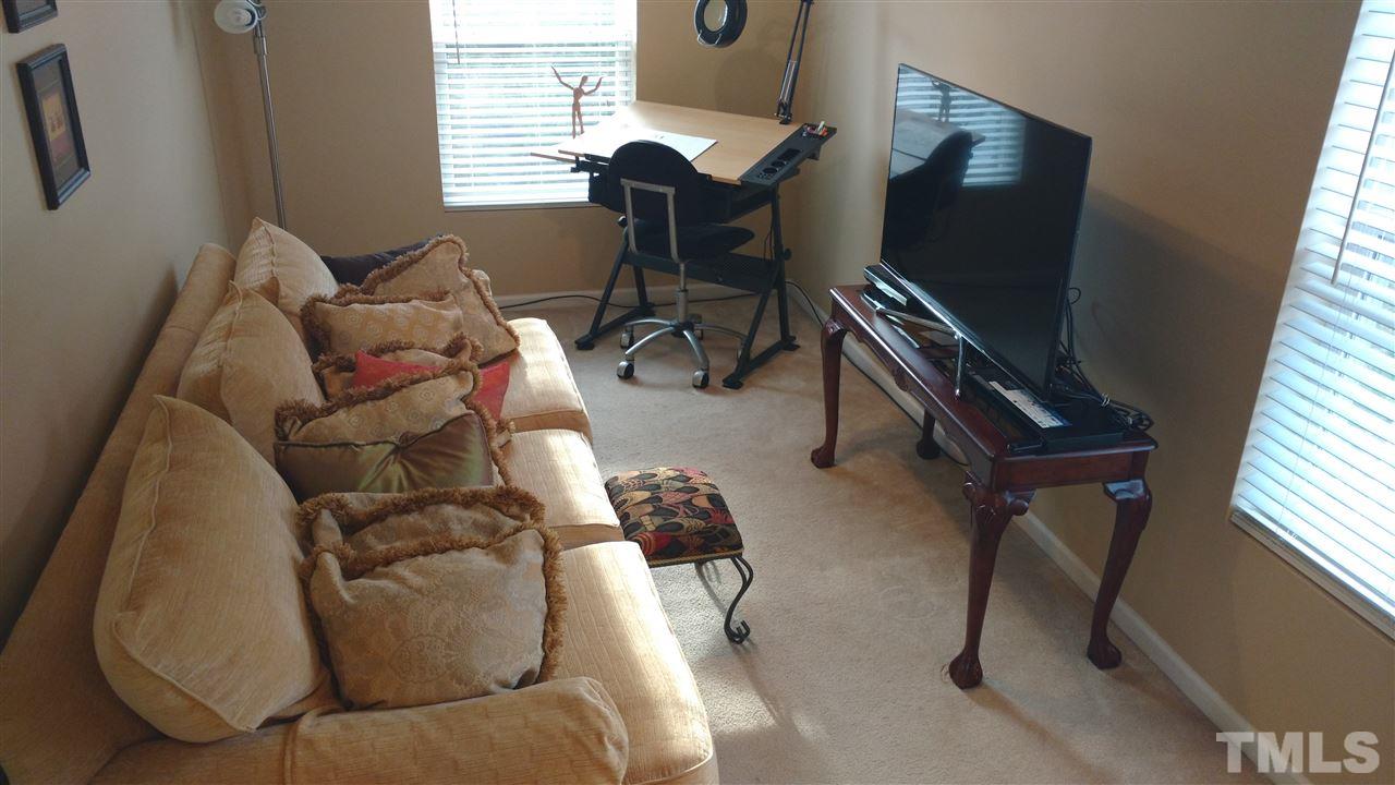 3812 Tryon Ridge Drive Raleigh, NC 27610 - Photo 10 of 23 a living room with furniture and a flat screen tv