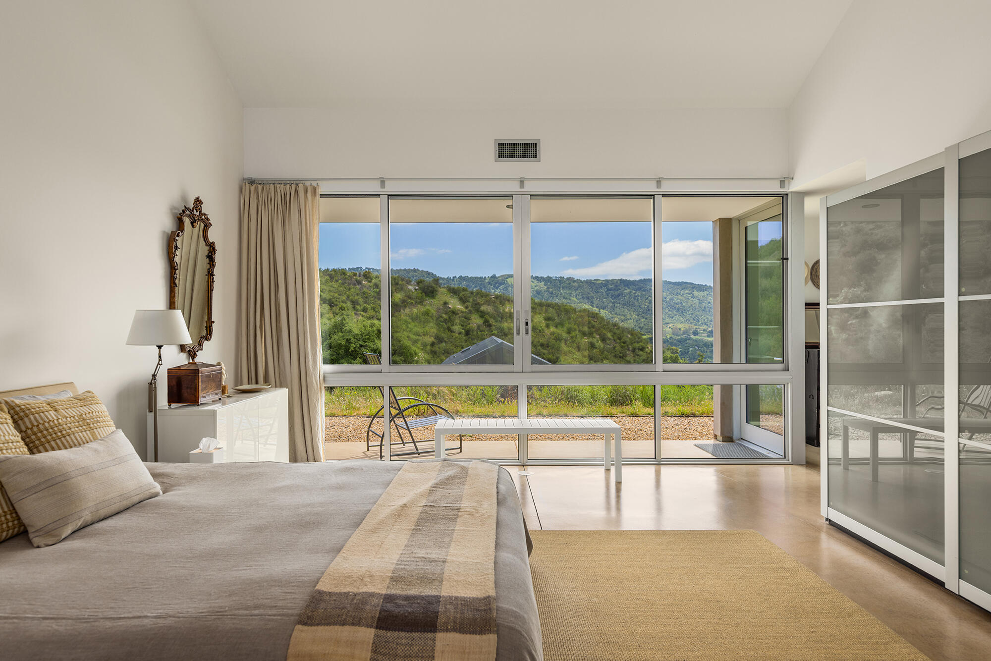 12179 Koenigstein Road Santa Paula, CA 93060 - Photo 28 of 43 a large white bed sitting in a bedroom next to a window
