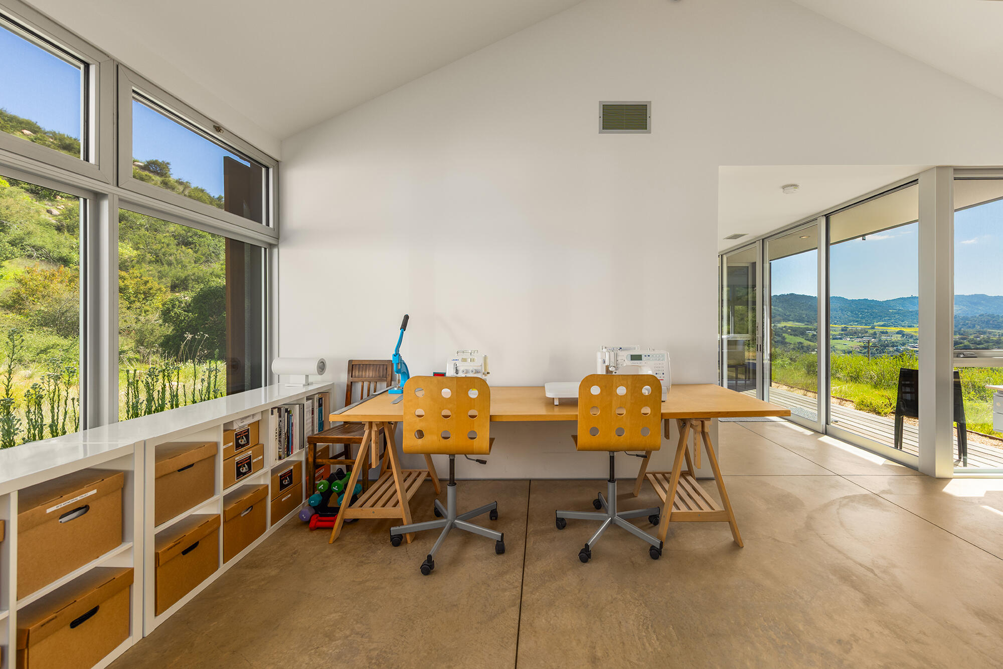 12179 Koenigstein Road Santa Paula, CA 93060 - Photo 38 of 43 a view of a workspace with furniture and floor to ceiling window