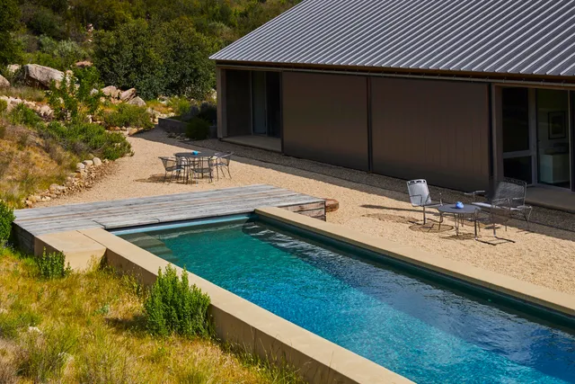 a view of deck with patio and mountain view