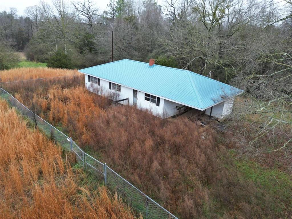 6050 Sandy Cross Road Carnesville, GA 30521 - Photo 5 of 5 a view of a tennis court with a yard