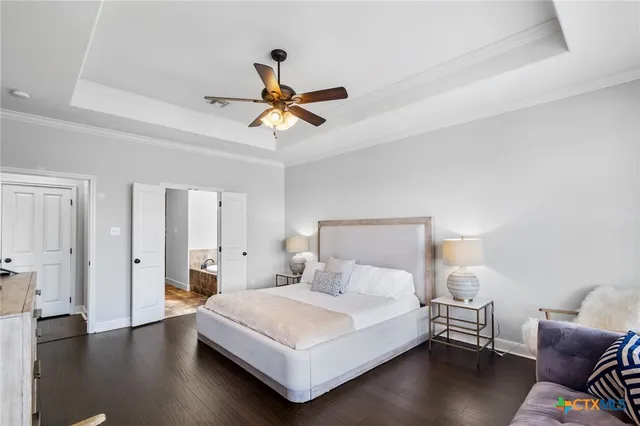 a bathroom with a tub and double vanity sink