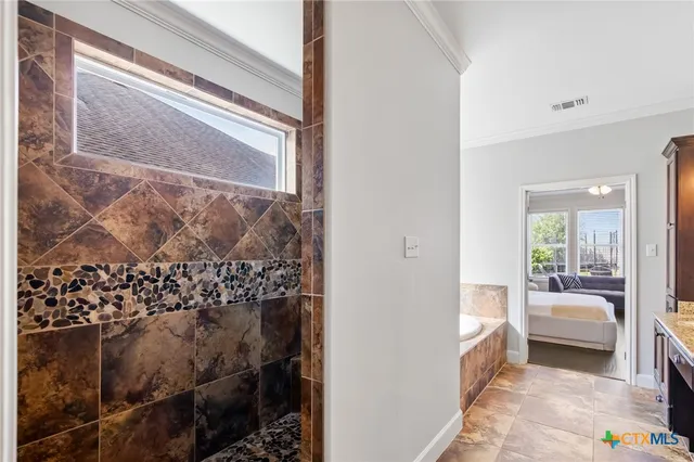 a bedroom with bed and wooden floor