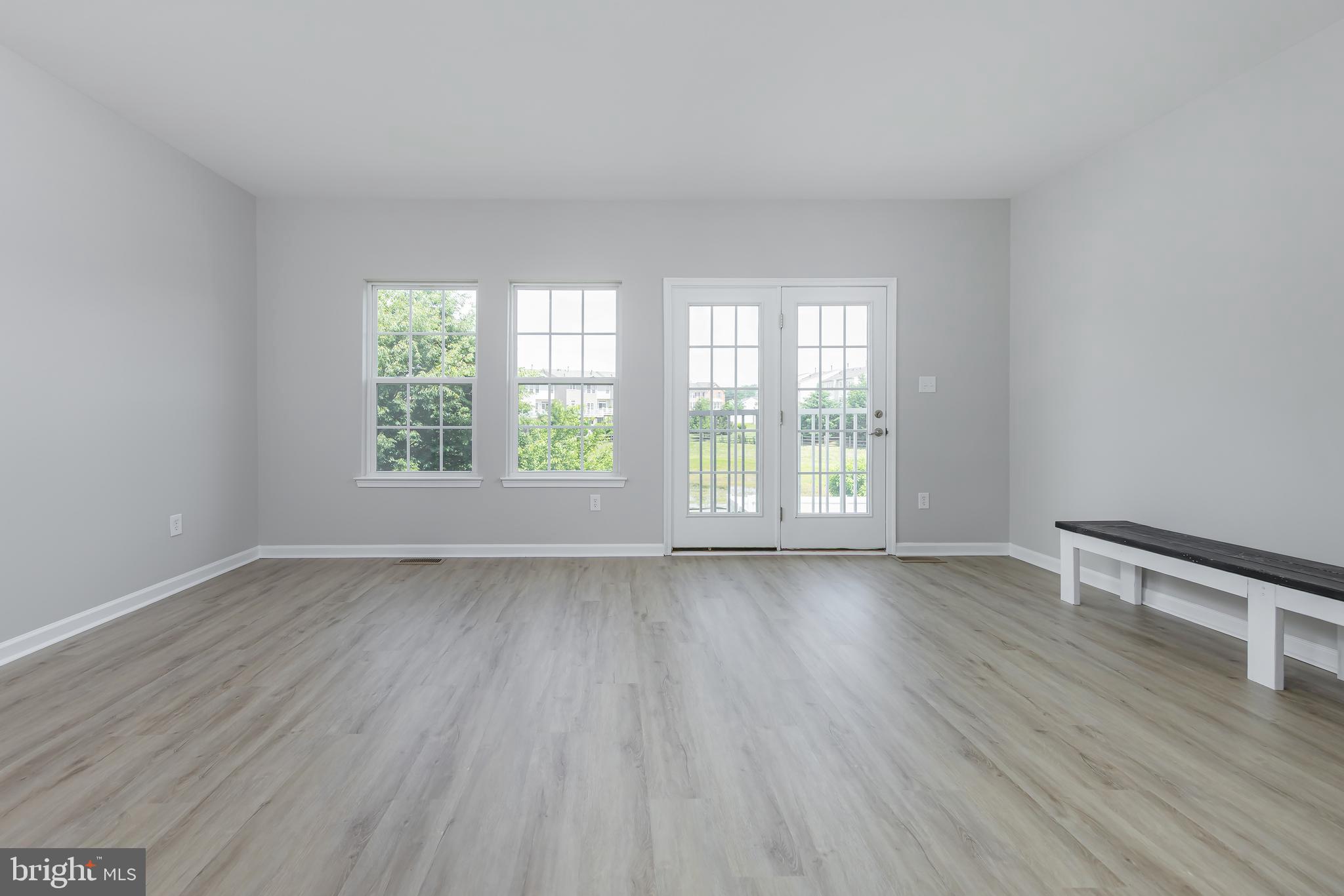 371 Concetta Drive Mount Royal, NJ 08061 - Photo 14 of 20 an empty room with wooden floor and windows