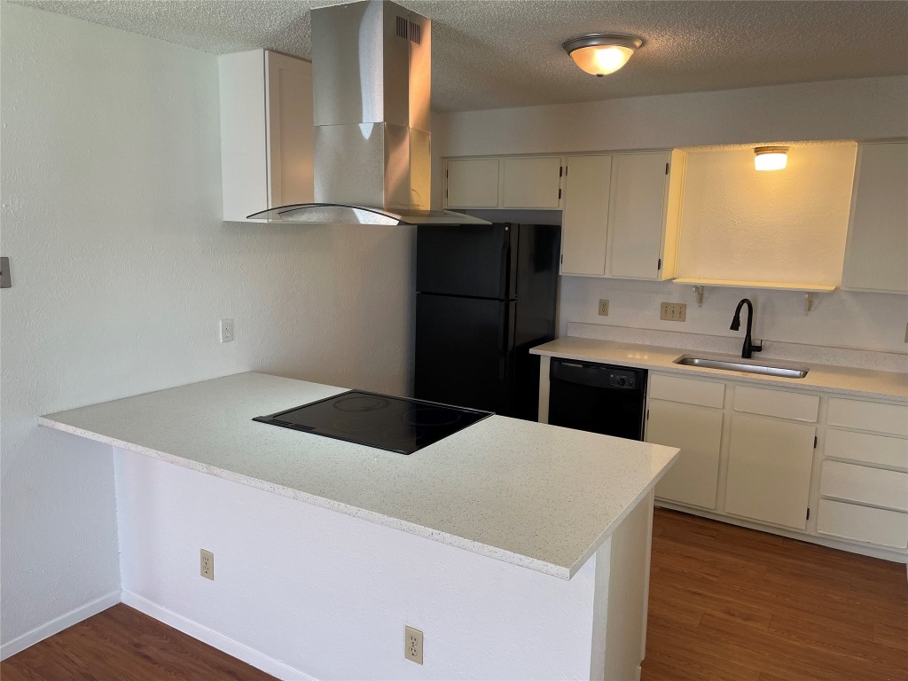 7506 St Amant Place, Unit B Austin, TX 78749 - Photo 13 of 16 a kitchen with a sink a stove and cabinets