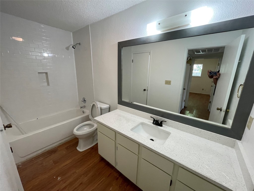 7506 St Amant Place, Unit B Austin, TX 78749 - Photo 6 of 16 a bathroom with a sink a toilet and a large mirror
