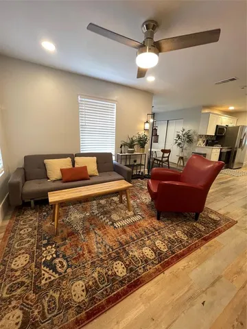 a spacious bedroom with a bed and window