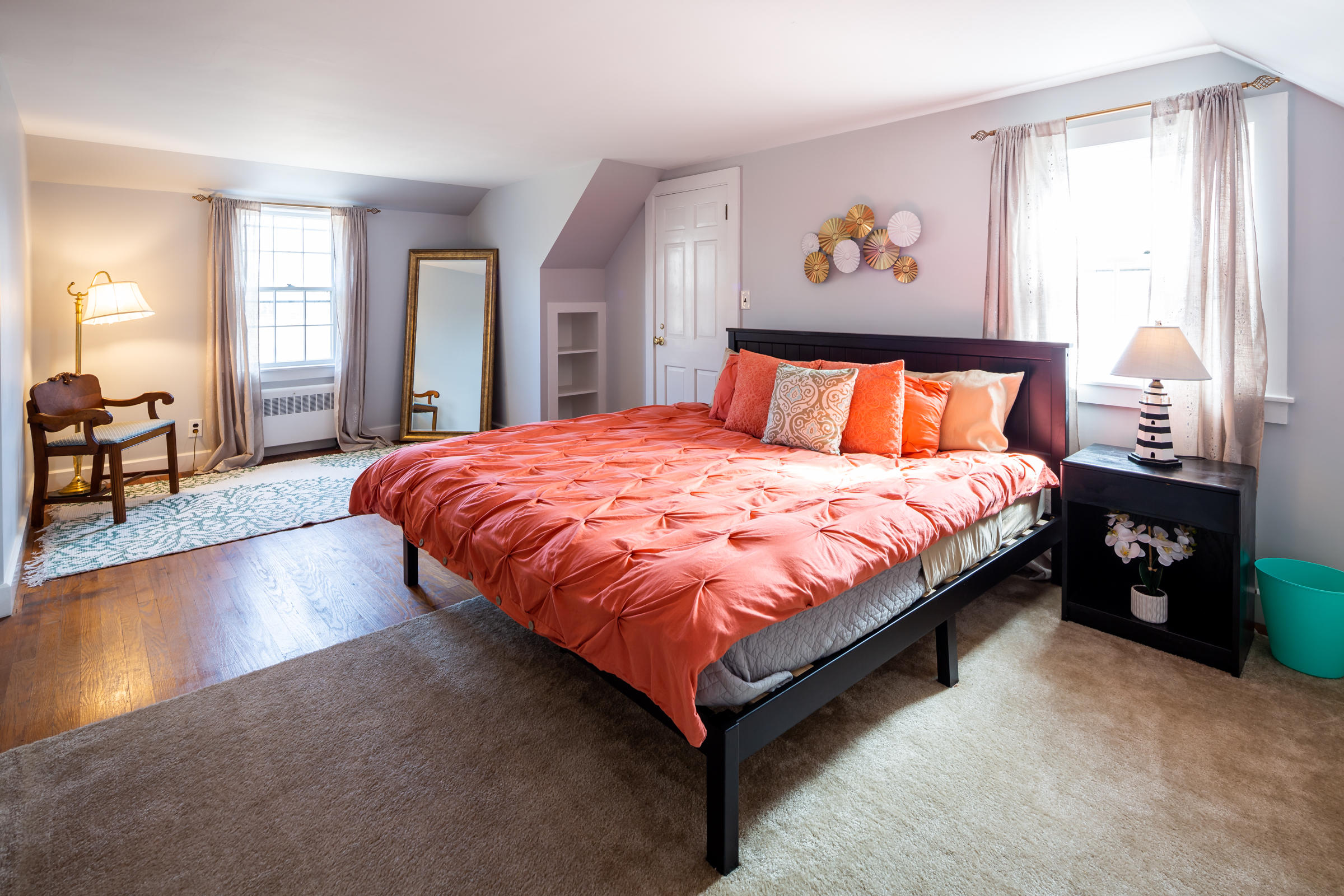 700 Main Street Cotuit, MA 02635 - Photo 12 of 20 a large bed sitting in a bedroom next to a window