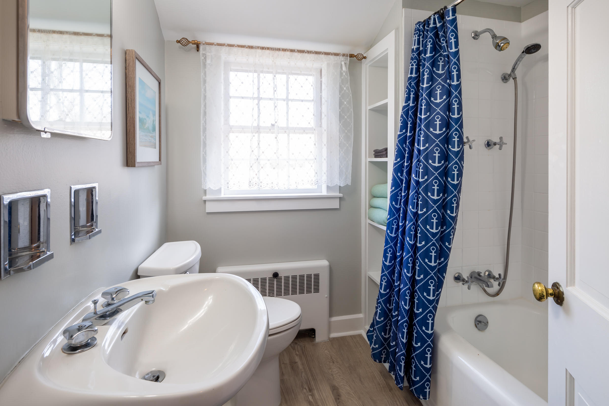 700 Main Street Cotuit, MA 02635 - Photo 14 of 20 a bathroom with a sink a toilet and a bathtub