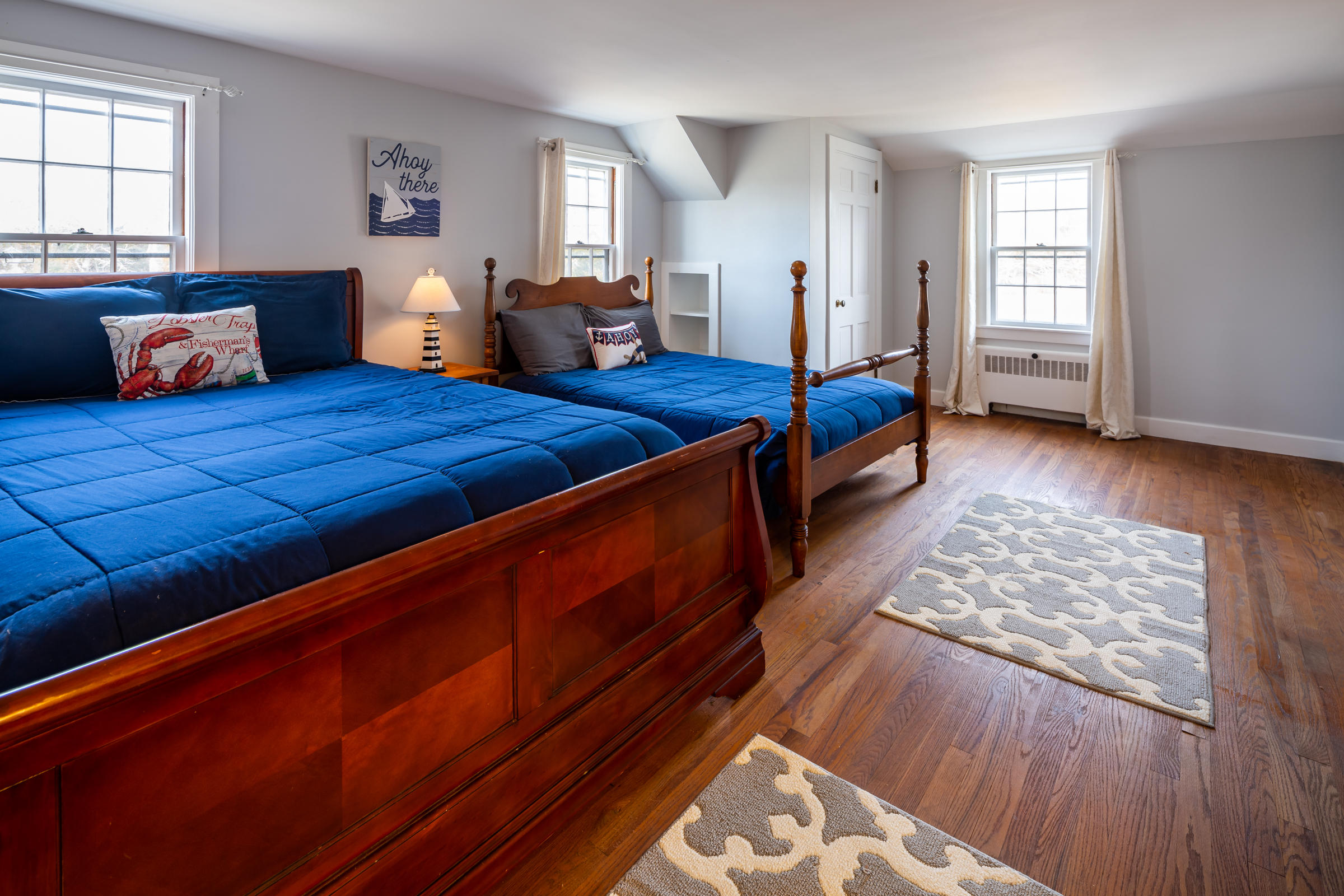 700 Main Street Cotuit, MA 02635 - Photo 15 of 20 a bedroom with furniture and wooden floor