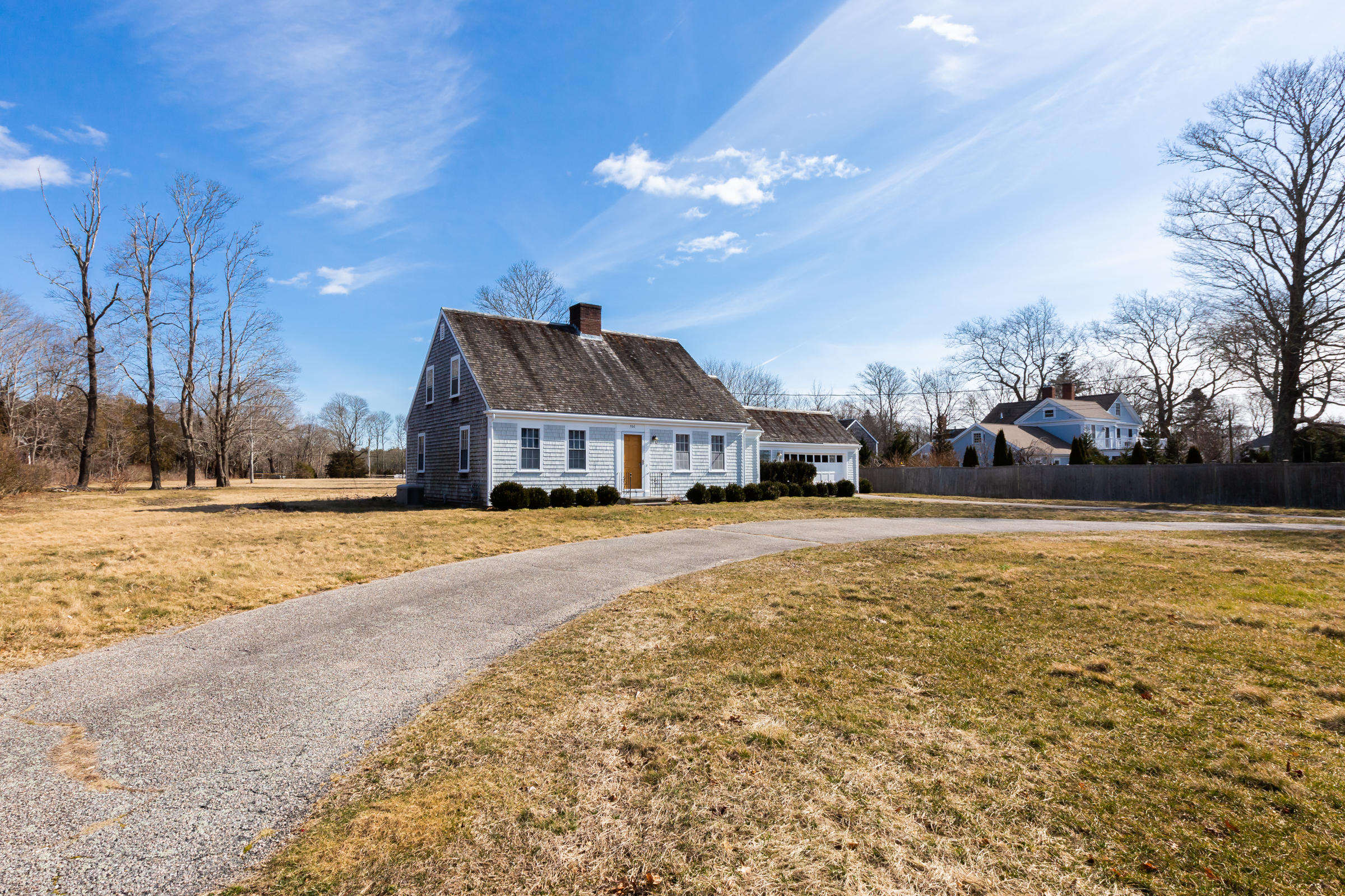 700 Main Street Cotuit, MA 02635 - Photo 20 of 20 a front view of a house with a yard