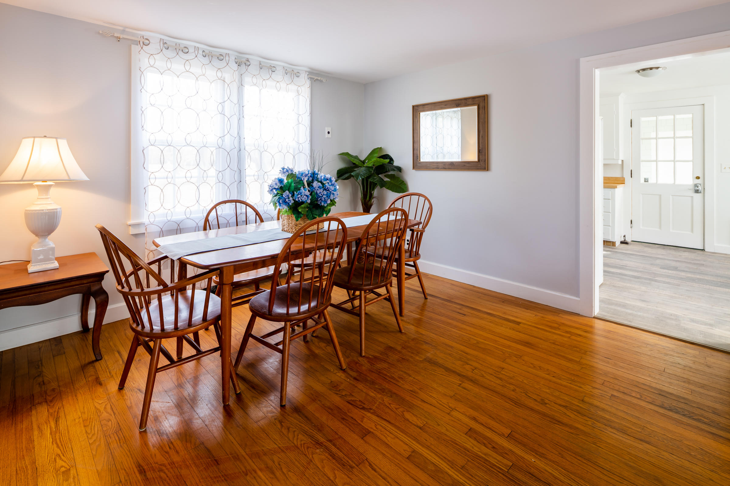 700 Main Street Cotuit, MA 02635 - Photo 5 of 20 a view of a dining room with furniture window and wooden floor