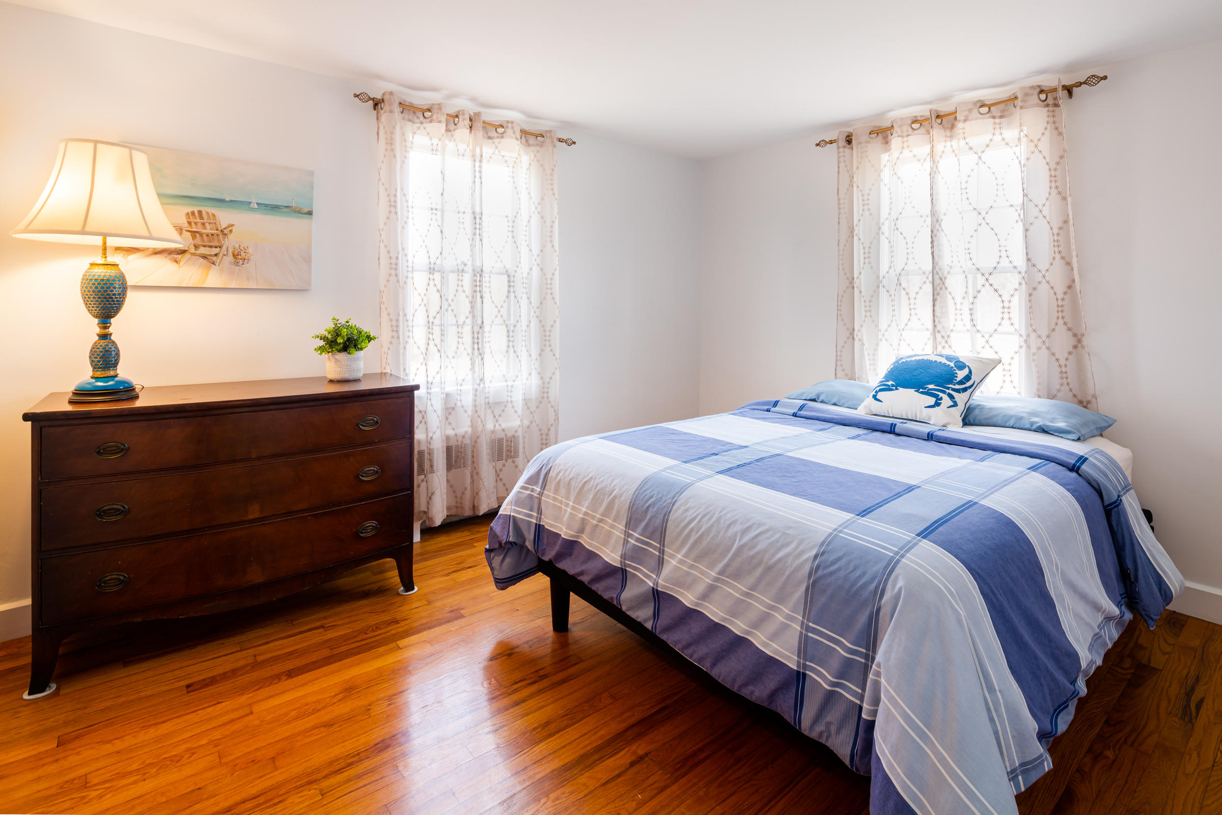 700 Main Street Cotuit, MA 02635 - Photo 9 of 20 a bedroom with a bed and window