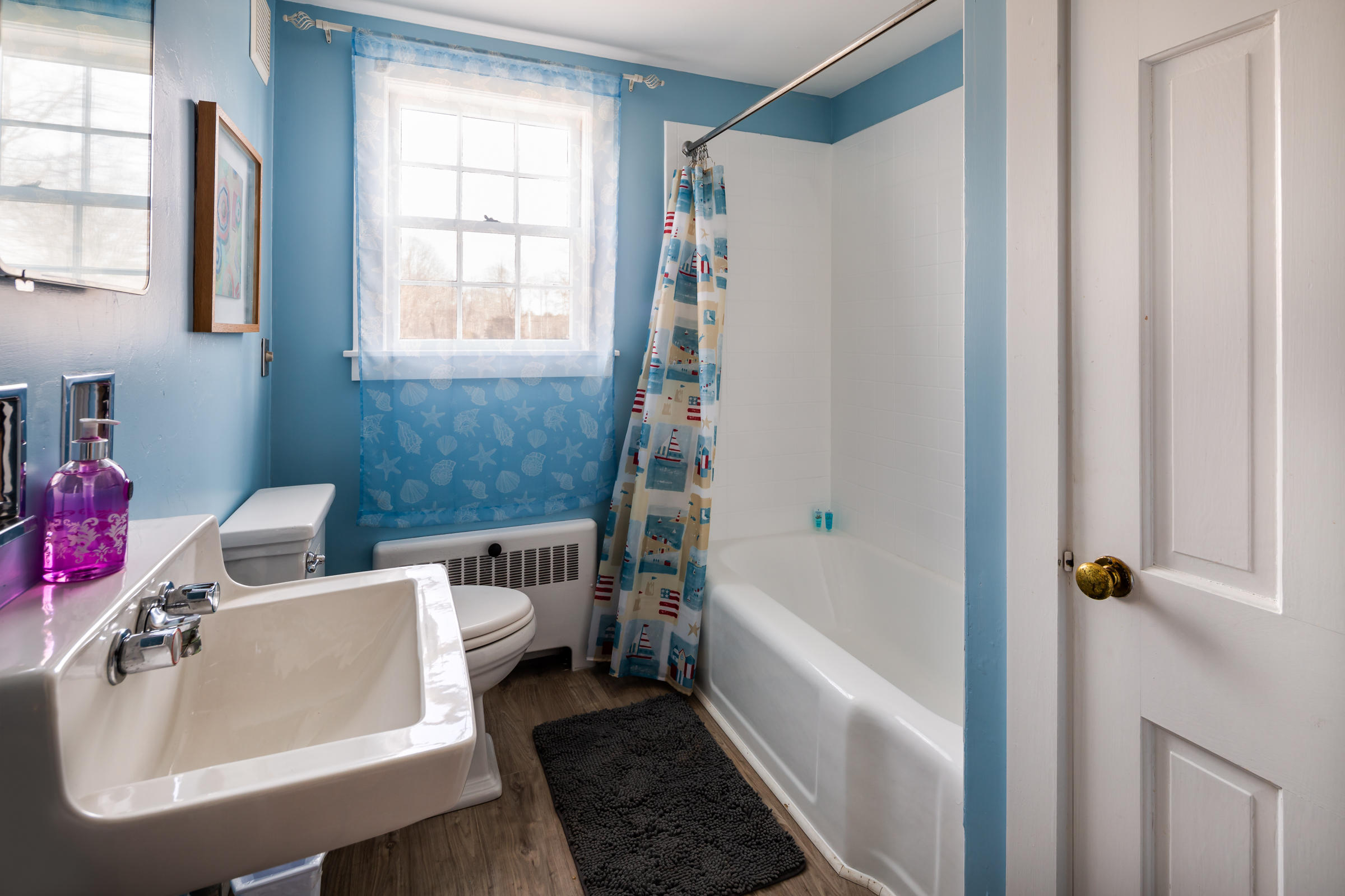 700 Main Street Cotuit, MA 02635 - Photo 10 of 20 a bathroom with a sink and a bathtub