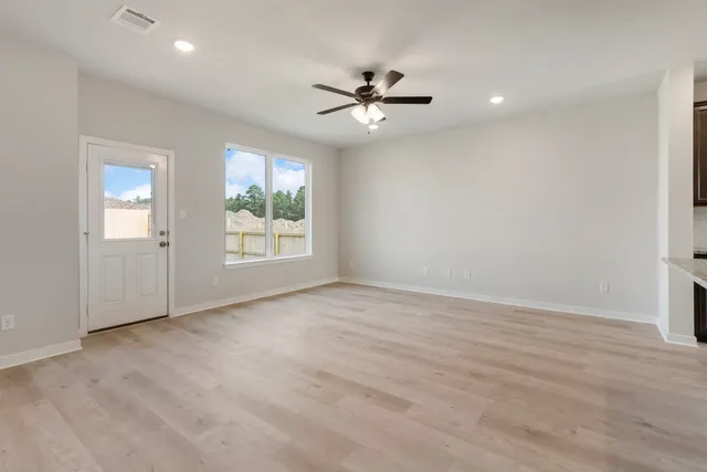 a view of an empty room with a window
