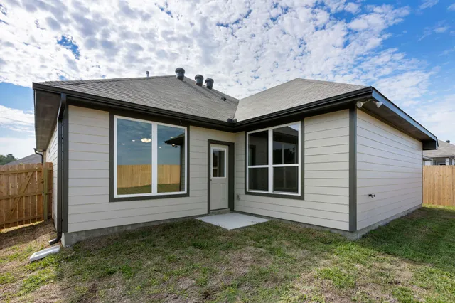 a house with window in front of it