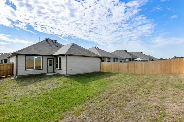 a backyard of a house with lots of green space