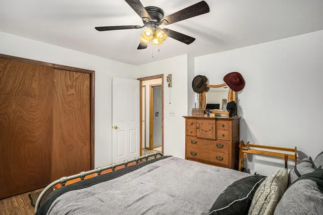 a bedroom with a bed and cabinets