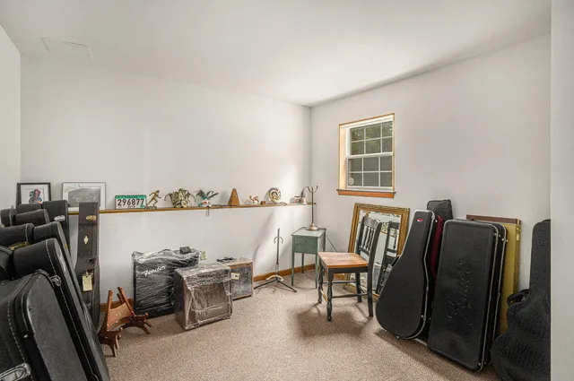 a view of a workspace with furniture and a couch