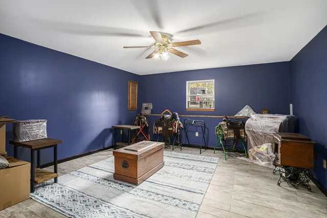 a bedroom with furniture and a window
