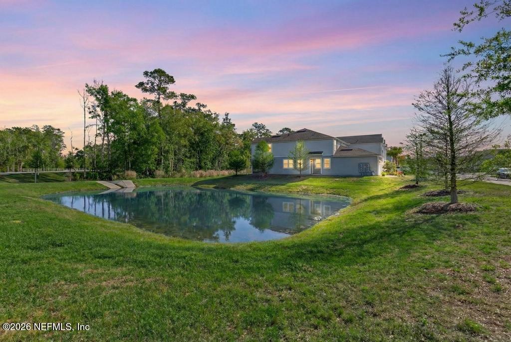 45 Seaport Breeze Road St. Augustine, FL 32095 - Photo 3 of 88 a view of a lake with a house in the background