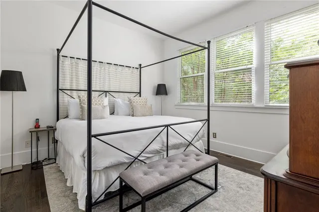 a view of staircase with furniture and a window