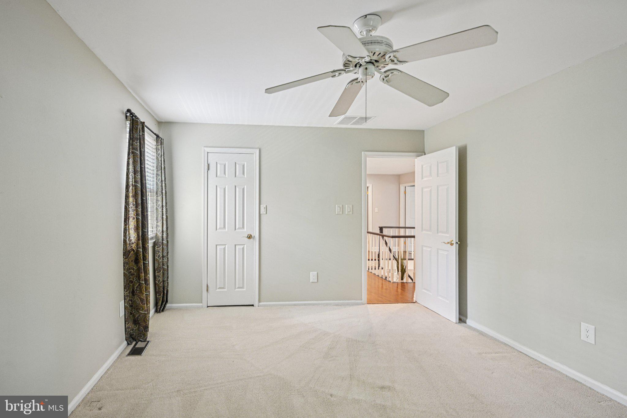 2 Keston Place Voorhees, NJ 08043 - Photo 36 of 83 en empty room with chandelier fan and windows