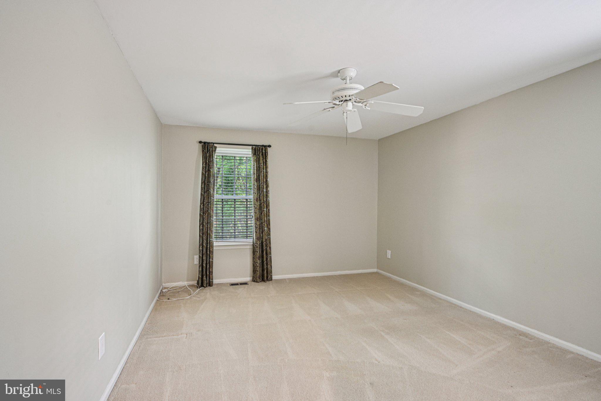 2 Keston Place Voorhees, NJ 08043 - Photo 37 of 83 an empty room with a window and ceiling fan