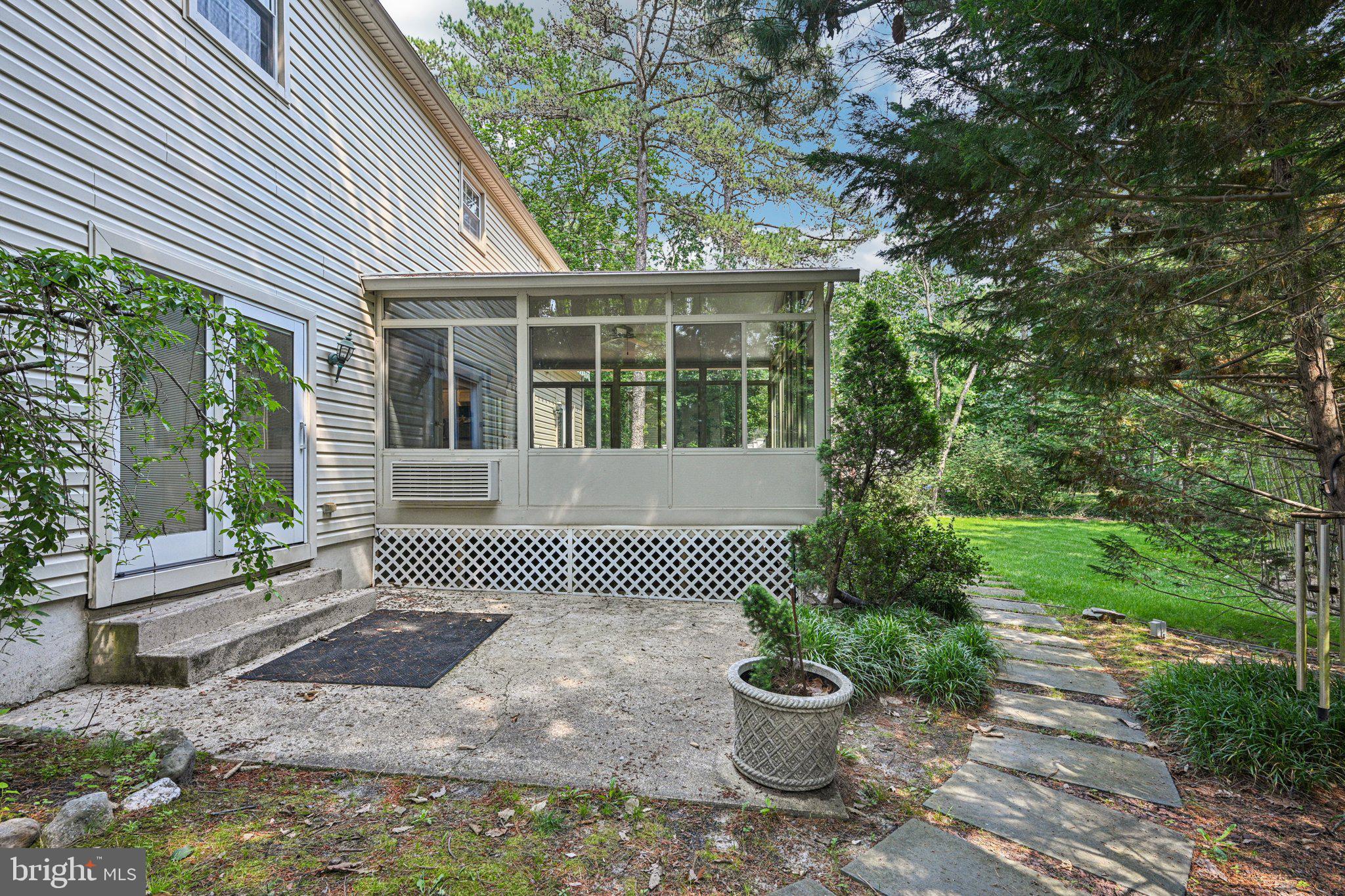 2 Keston Place Voorhees, NJ 08043 - Photo 54 of 83 a front view of a house with a garden