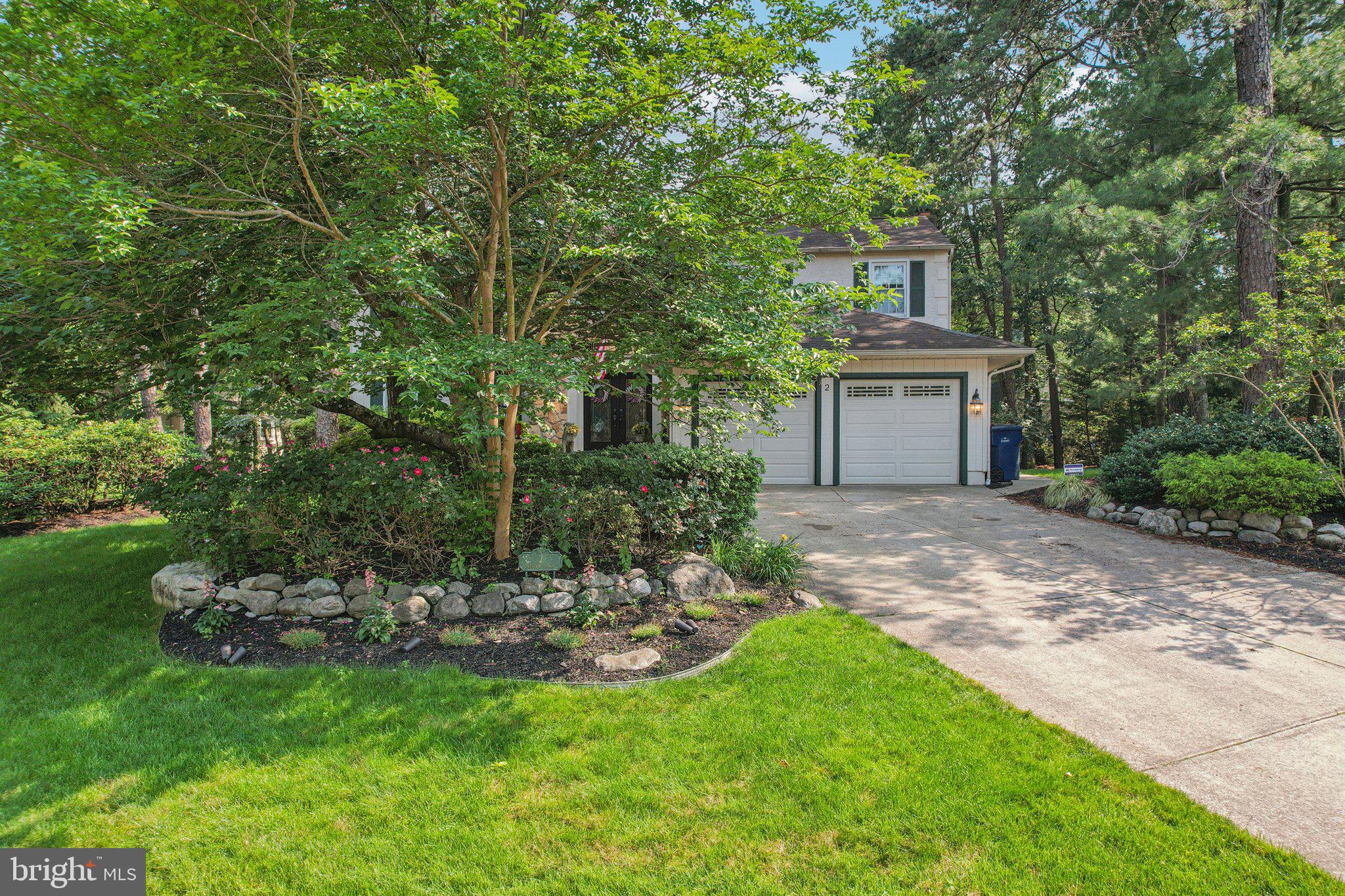2 Keston Place Voorhees, NJ 08043 - Photo 64 of 83 a view of a backyard with table and chairs and potted plants and large trees