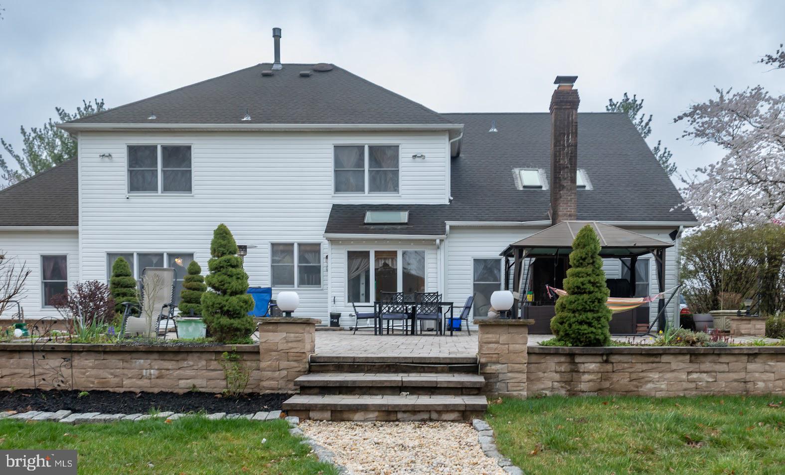 562 Village Road West Princeton Junction, NJ 08550 - Photo 17 of 25 a front view of a house with a yard