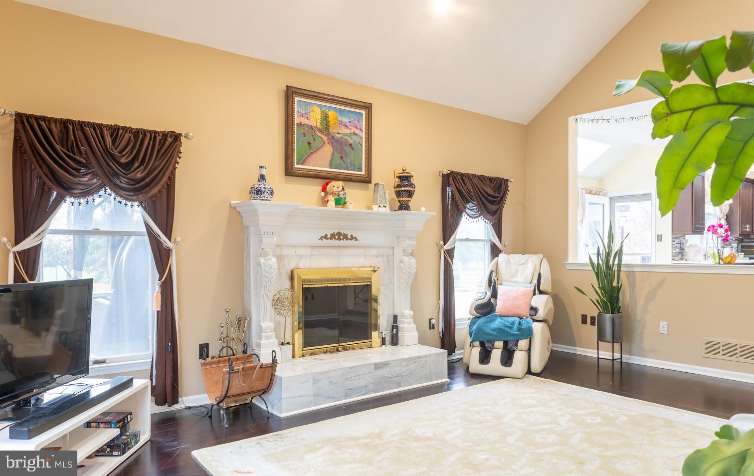 562 Village Road West Princeton Junction, NJ 08550 - Photo 18 of 25 a living room with furniture and a fireplace