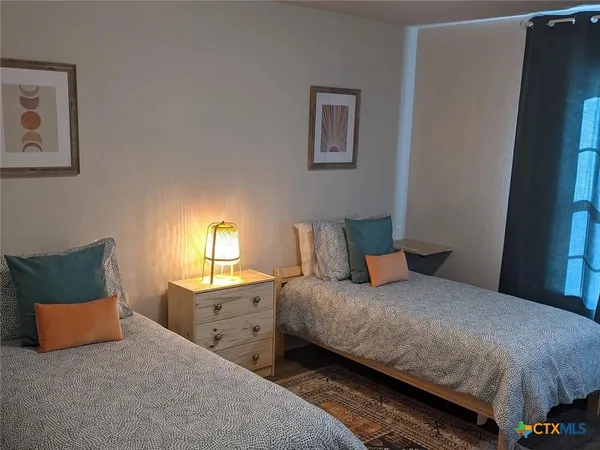 a bedroom with a bed and a couch