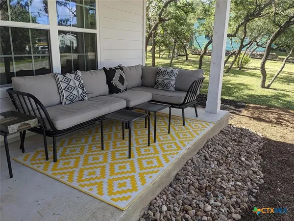 a view of a two chairs in the deck