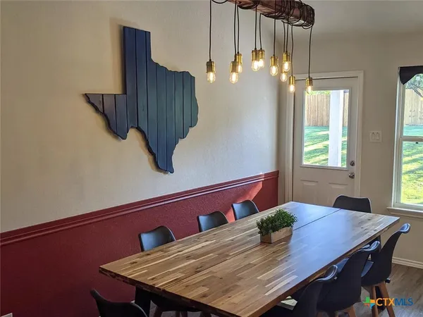 a view of a dining room with furniture