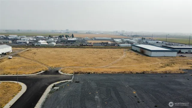 an aerial view of a house with a lake view