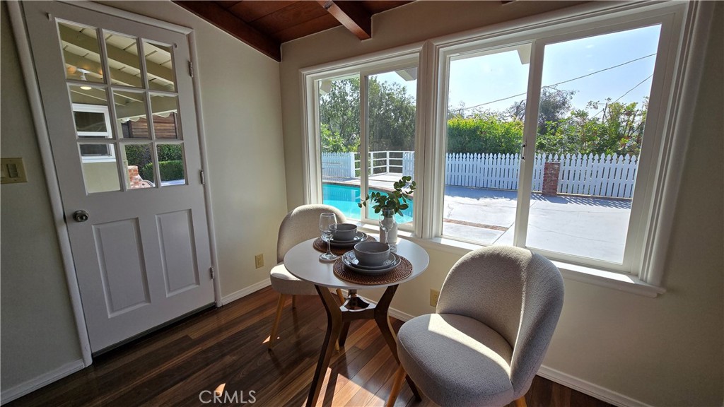 1111 Arbor Dell Road Los Angeles, CA 90041 - Photo 17 of 42 a view of a dining room with furniture wooden floor and a potted plant