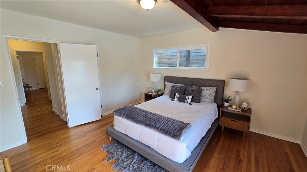 1111 Arbor Dell Road Los Angeles, CA 90041 - Photo 25 of 42 a bedroom with a bed and wooden floor