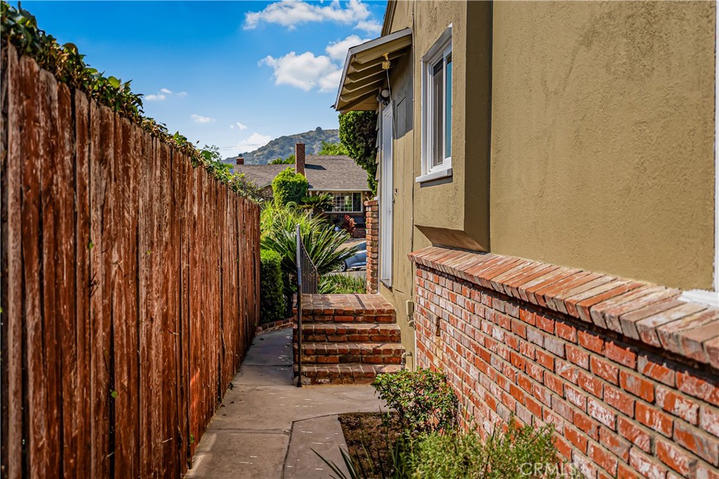 1111 Arbor Dell Road Los Angeles, CA 90041 - Photo 31 of 42 a view of a house with a backyard and stairs
