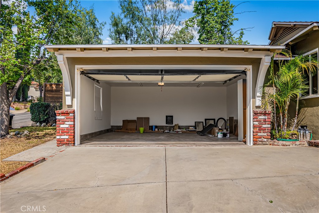 1111 Arbor Dell Road Los Angeles, CA 90041 - Photo 34 of 42 a view of garage with a car and parked car