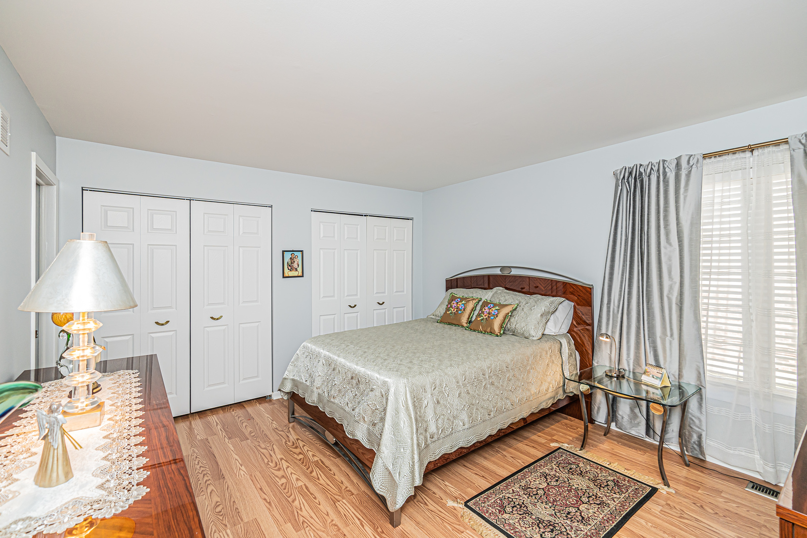 159 Harding Avenue Des Plaines, IL 60016 - Photo 30 of 44 a bedroom with a bed and a lamp