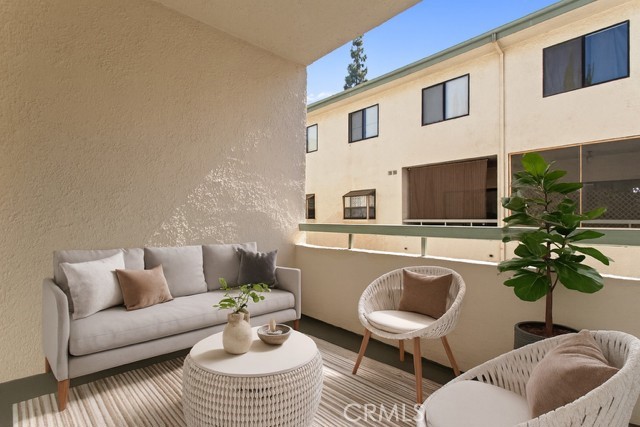 7230 Kelvin Avenue, Unit 6 Winnetka, CA 91306 - Photo 3 of 12 a living room with furniture a rug and a couch
