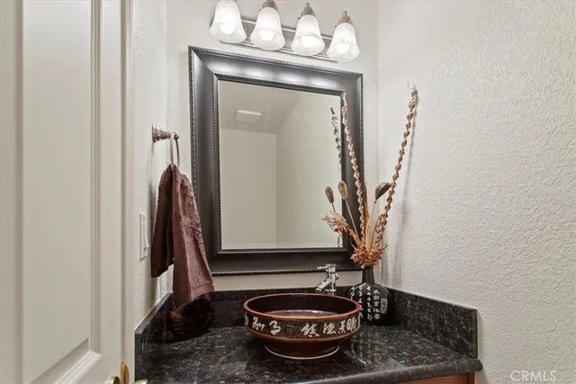 a room with a table and a potted plant