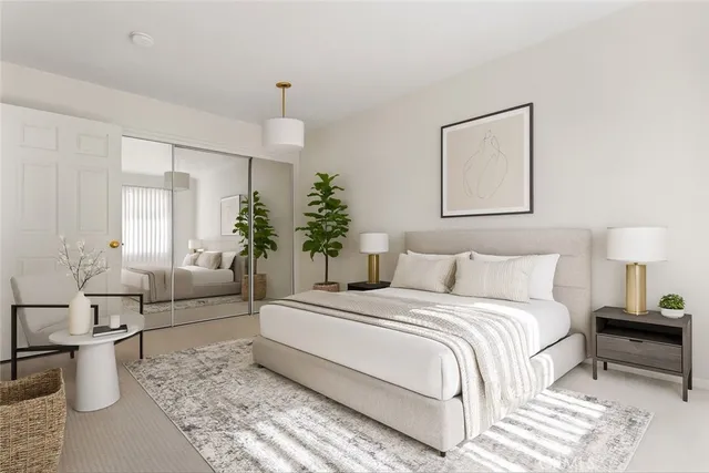 a bedroom with a large bed and a couch