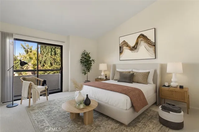 a bedroom with a bed and a painting on the wall