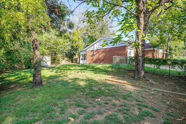 a view of backyard with green space