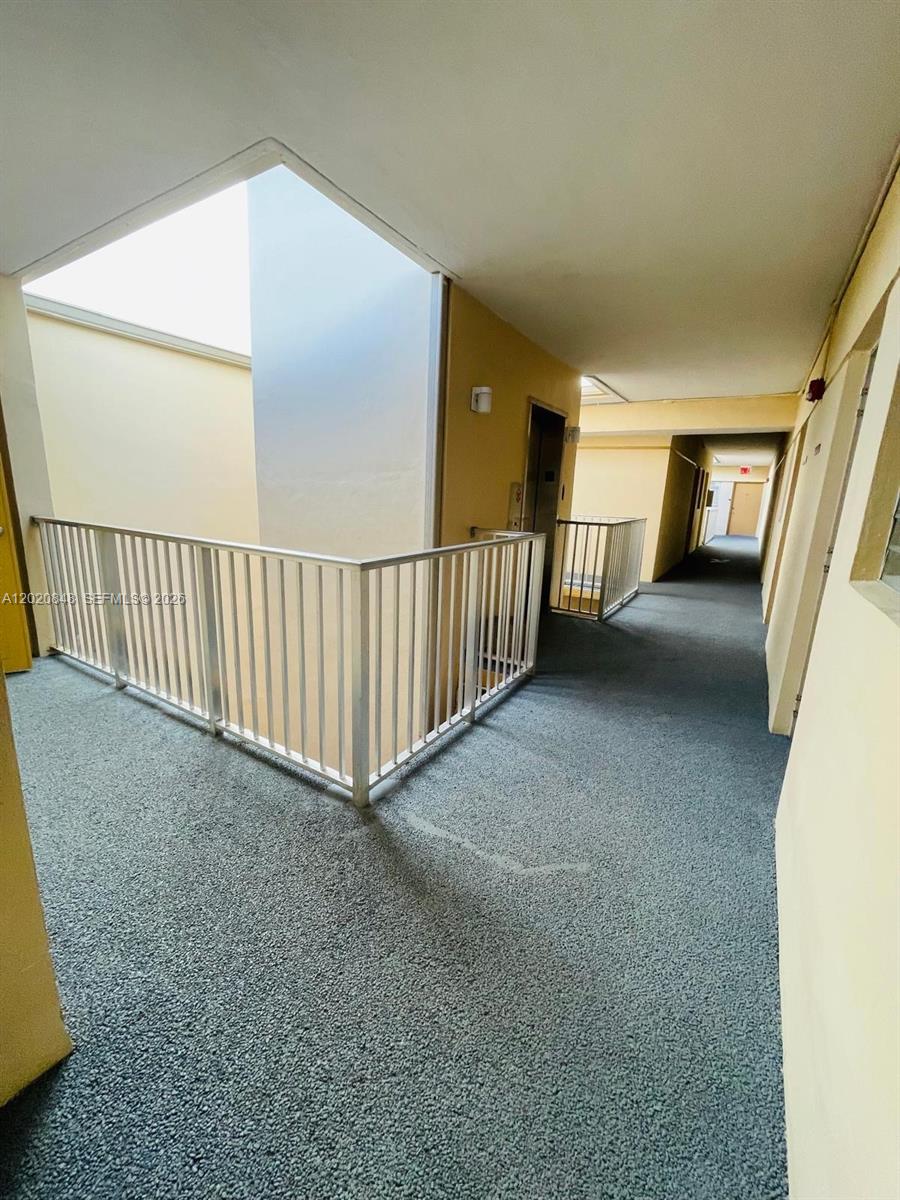 9175 Southwest 77th Avenue, Unit 306 Miami, FL 33156 - Photo 16 of 16 a view of a porch with wooden floor