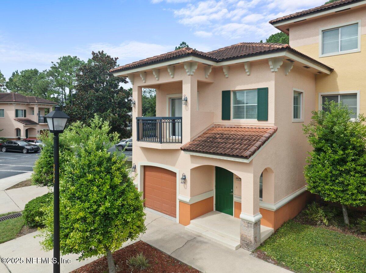 9745 Touchton Road, Unit 2421 Jacksonville, FL 32246 - Photo 1 of 26 front view of a house with a yard