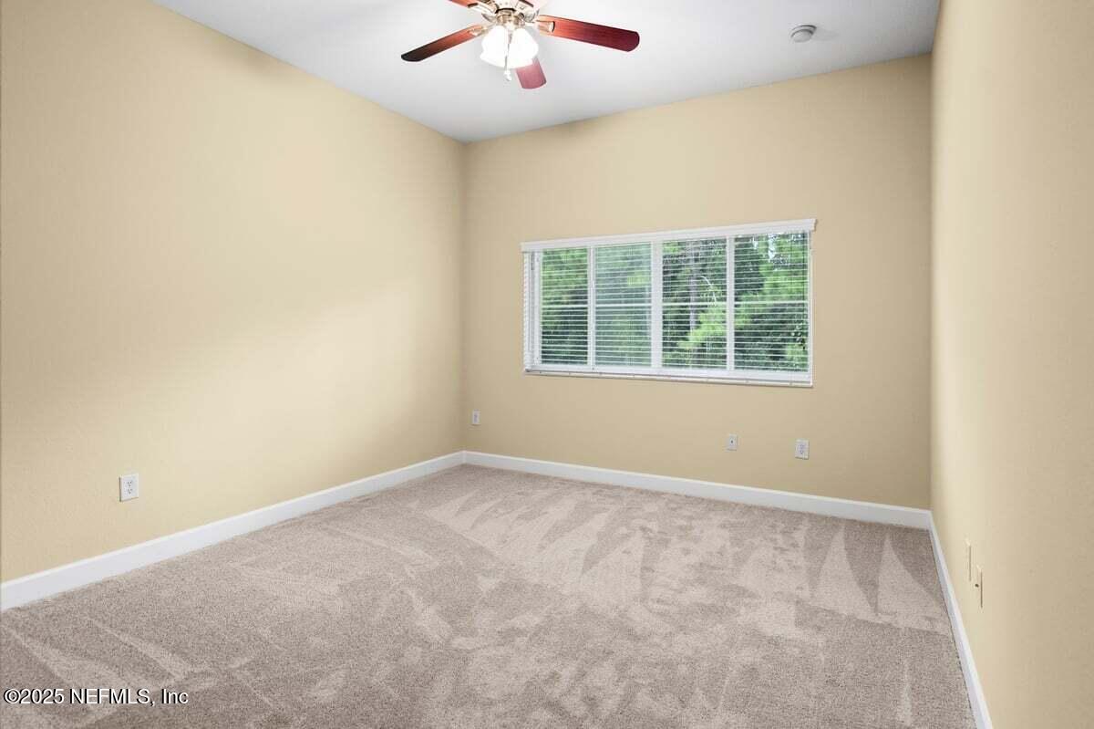 9745 Touchton Road, Unit 2421 Jacksonville, FL 32246 - Photo 11 of 26 an empty room with a window